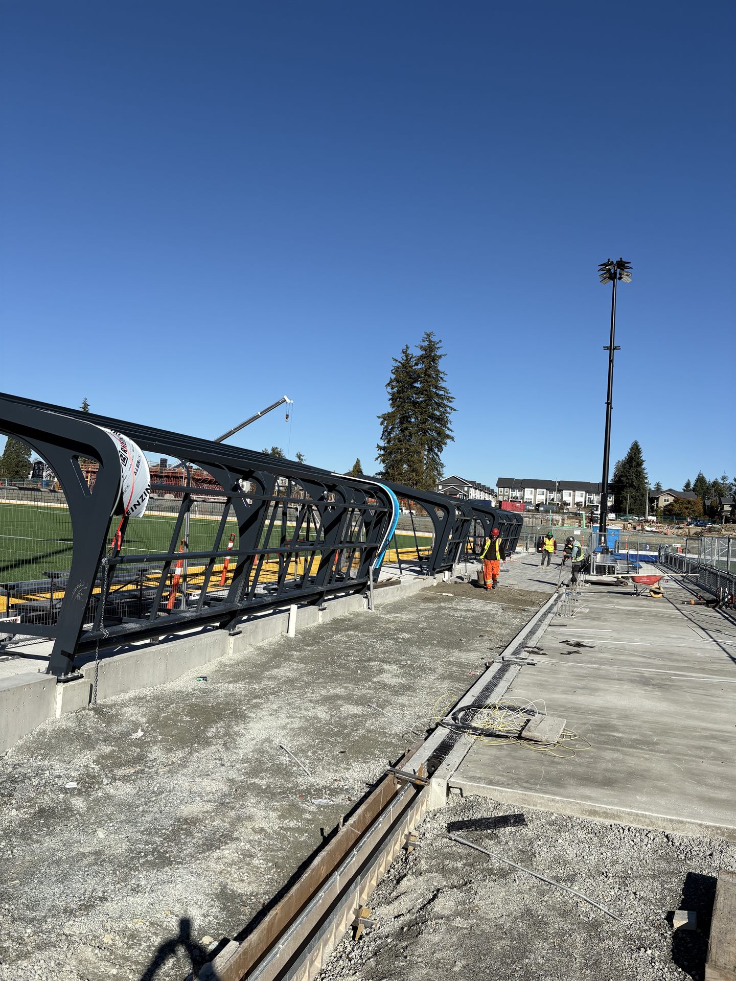 Burrard Mechanical crew installing a structural steel walkway on site